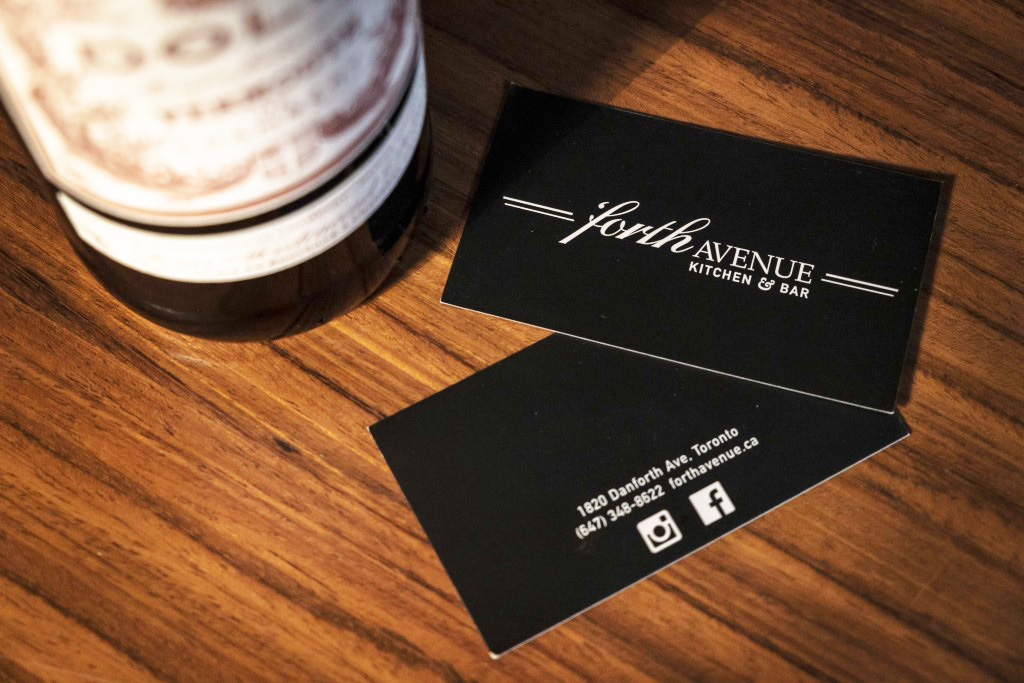 a black forth avenue business card