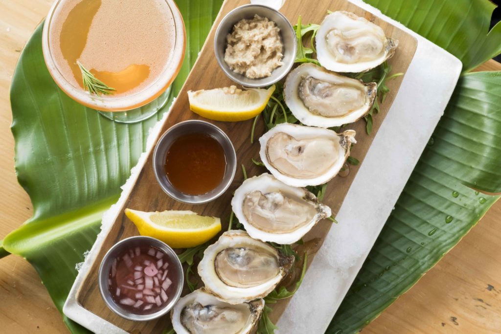 oysters served with hot sauce and mignonette