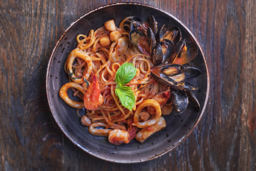 linguini with tomato sauce, shrimp, scallops, and muscles