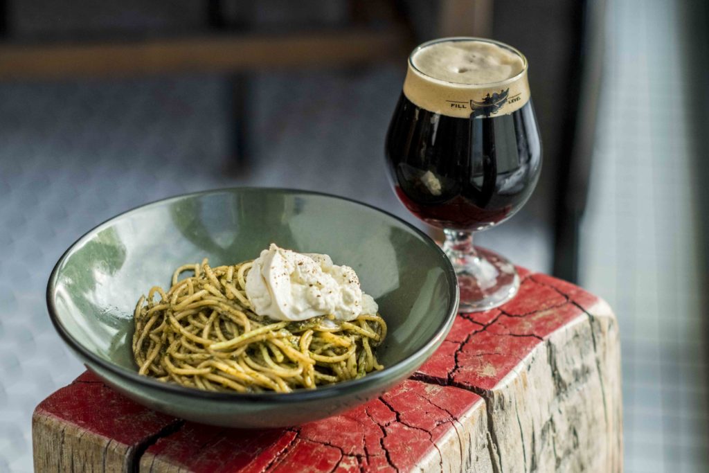 pesto pasta and dark beer