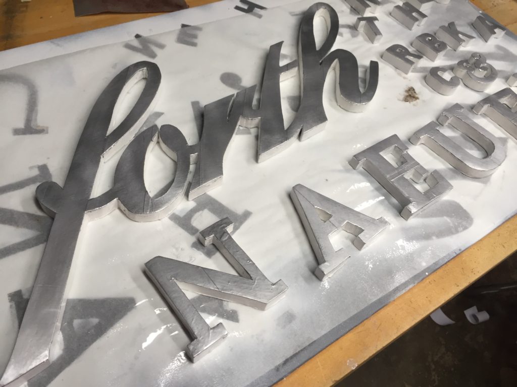 the wooden sign in process of being made