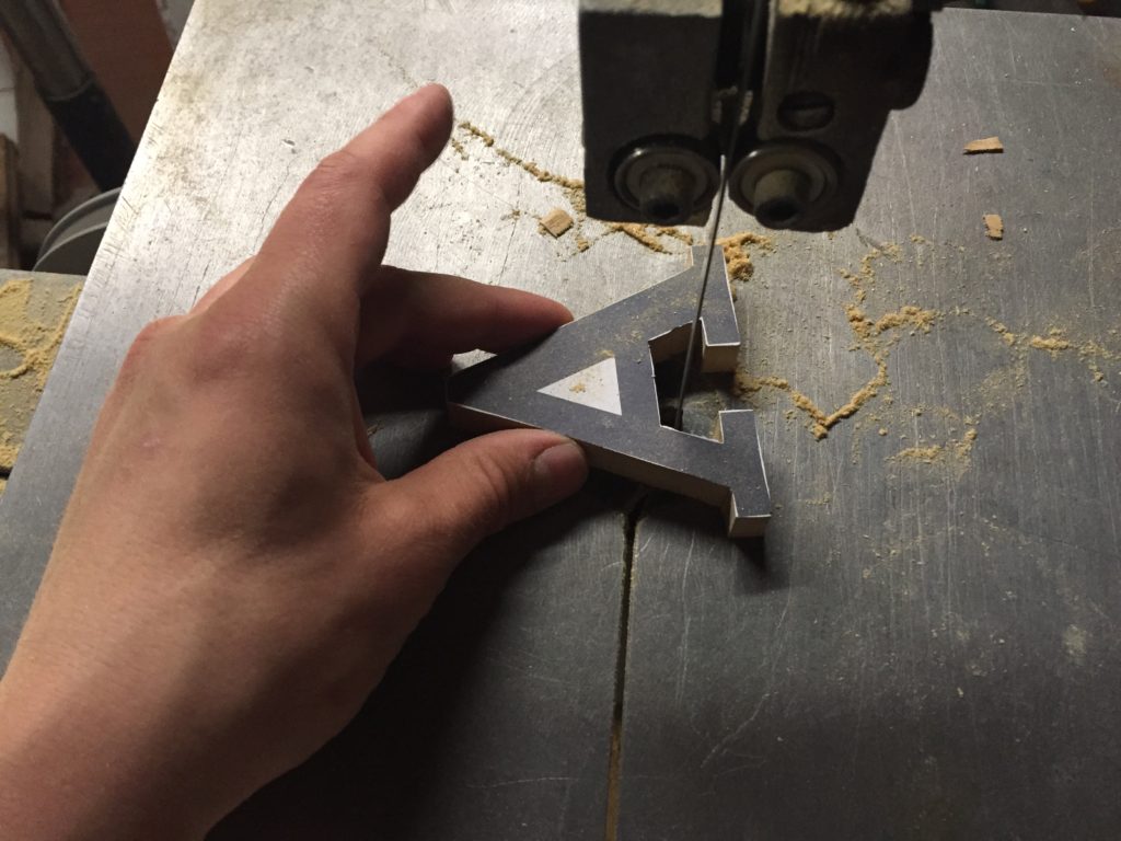 the wooden sign in process of being made