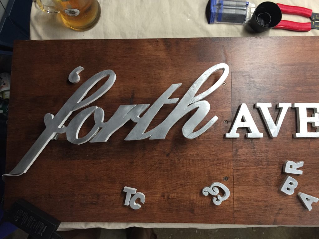the wooden sign in process of being made