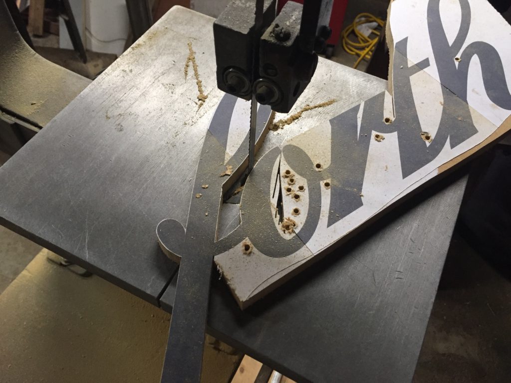 the wooden sign in process of being made