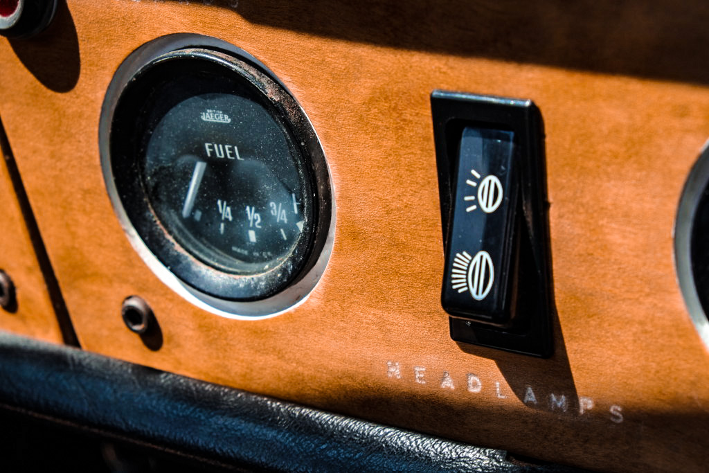 dashboard closeup of headlamp button