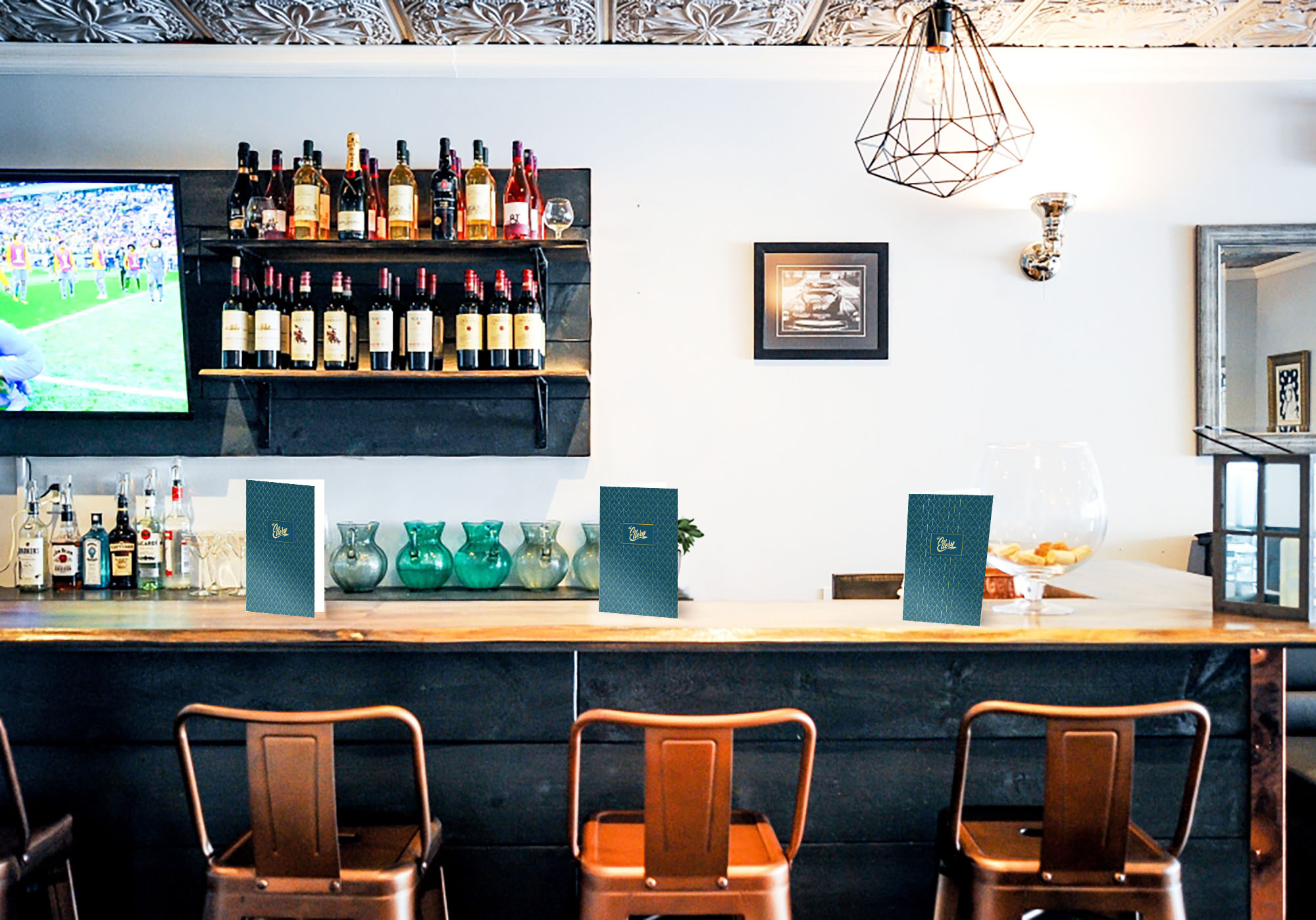 Inside of the Ellery, showing the bar with menus on it.