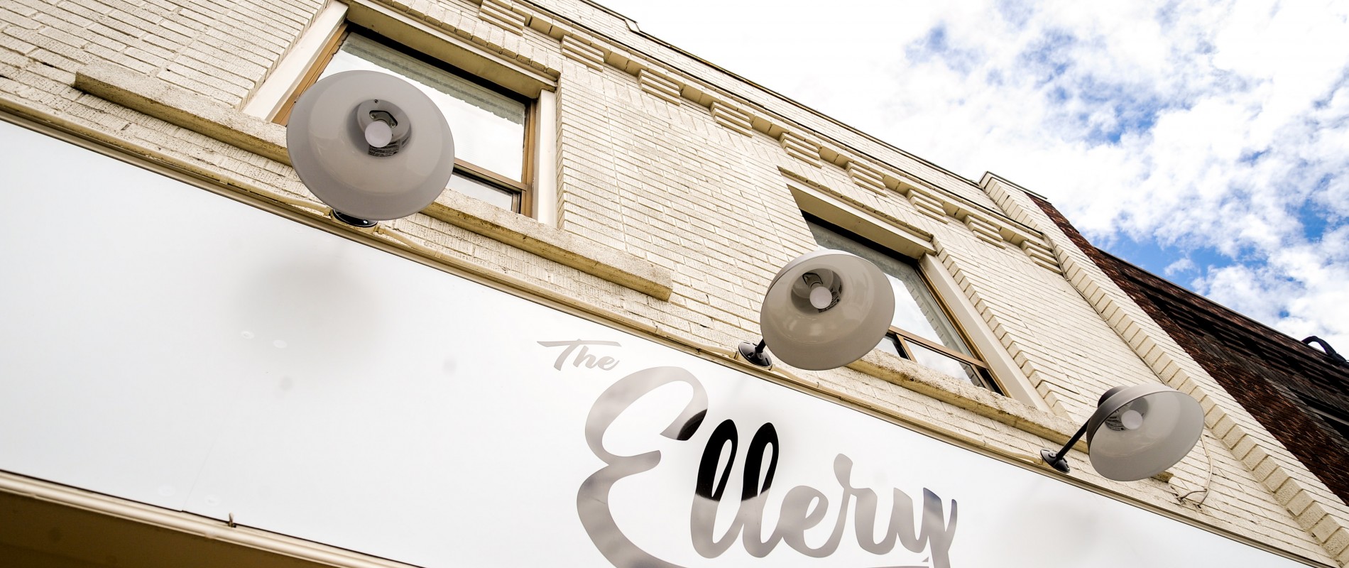 Outdoor sign that hangs over The Ellery Restaurant