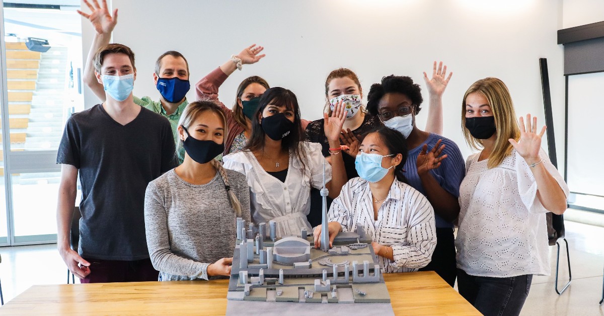 members of the design team pose with the design