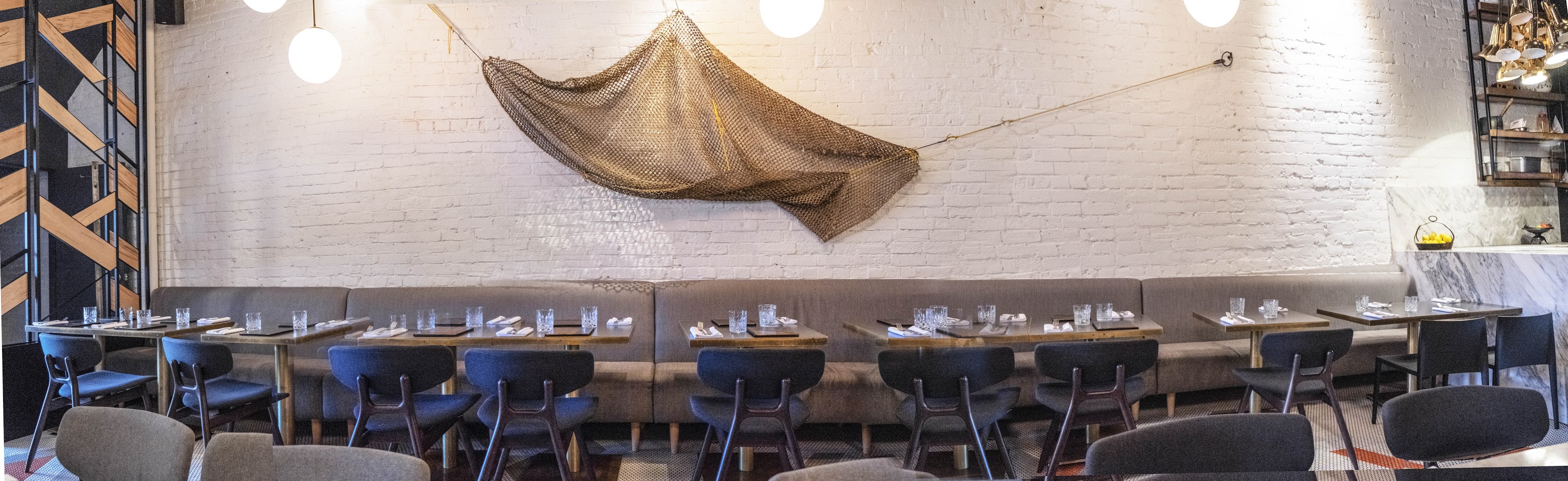 half bench seating for 24 with a fish net decoration